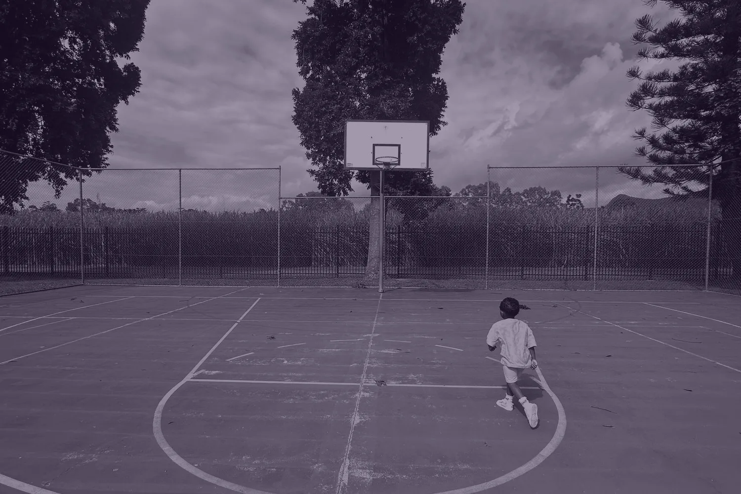 Children playing basketball at Kara Ged